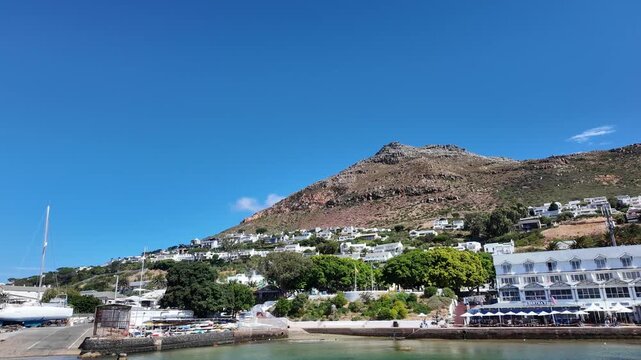 Simon's Town Western Cape South Africa. 18.02.2026. Video.  A picturesque seaside town with white buildings cascading down a hillside towards a harbour 