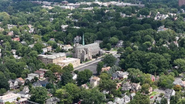 Ascending pullback revealing South Orange buildings and surrounding residential neighborhoods
