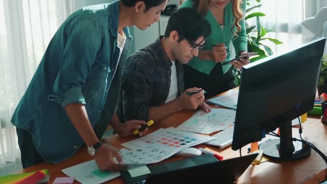 Top view of project manager looking at screen while designer writing idea. Close up of smart business team explain idea of logo design while designer choose theme while looking at palette. Symposium.