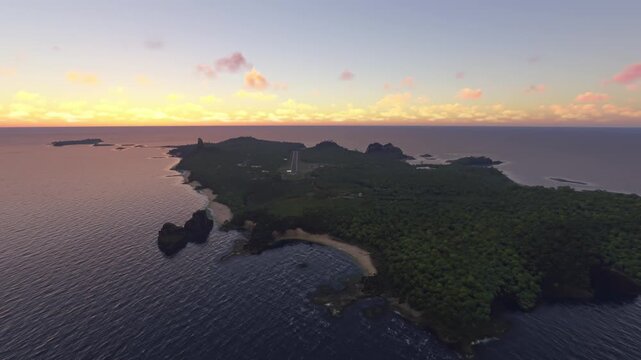 Circular aerial drone view at sunset of Sancho Beach in Pernambuco island. Brazil
