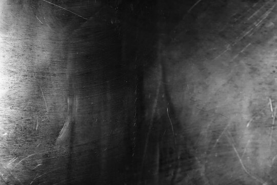 Scratched and Worn Dark Metal Texture, Grunge Background with Scratches and Brush Marks