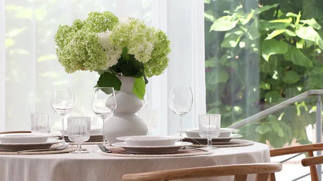 Beautiful place setting with floral decor on table indoors