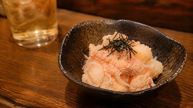 japanese mentaiko potato salad topped with shredded nori