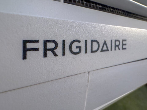Ottawa, Ontario, Canada. August 21, 2026. Extreme close up view of Frigidaire brand name logo printed on white household appliance body.