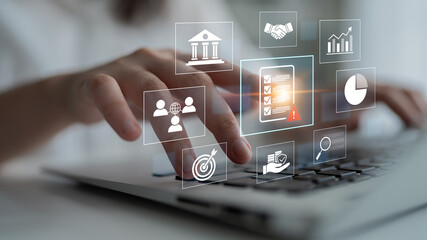 Fototapeta na wymiar Businessman Using Laptop with Abstract Icons Representing Digital Solutions and Financial Data for Effective Management and Analysis in Modern Workplace. Bitwise.