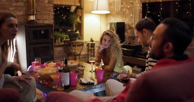 Birthday party celebration for a girl at home with friends enjoying snacks and games in the living room