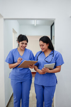 couple of latina women doctors or nurses portrait in a Mexican Hospital in Mexico Latin America. Hispanic healthcare female workers