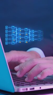 Businessman typing on laptop keyboard vertical shot displaying glowing decision tree flowchart diagram nodes. Big data hierarchy structure, algorithm logic, and digital process workflow concept.