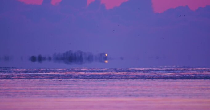 Pastel winter dawn over a snow-covered landscape in Hokkaido, Japan