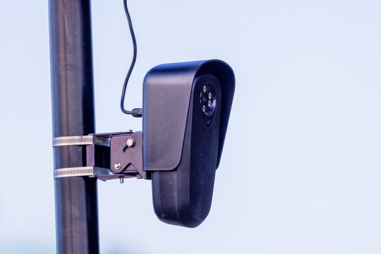 Close-up automated license plate reader camera mounted on pole