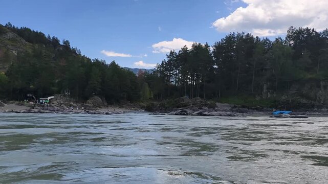Slow motion of speedboating on Altai river Katun near mouth of the Chemal River