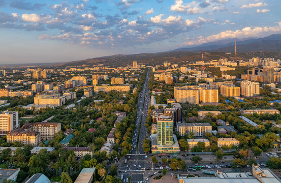 A picturesque drone view of the Kazakh city of Almaty at sunset on a summer evening.