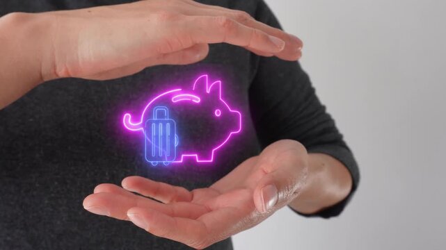 Smart savings for travel. Close-up of a woman's hands cupping a virtual icon of a piggy bank and a travel suitcase