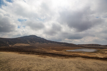 Obraz premium Mysterious Spring landscape of Kusasenrigahama or Aso Kusasenri Grassland at Aso-Kuju National Park. Aso, Kumamoto, Japan