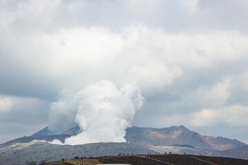 Fototapeta premium Beautiful Spring landscape of Kusasenrigahama or Aso Kusasenri Grassland with Mount Aso Volcanic eruption. Aso, Kumamoto, Japan