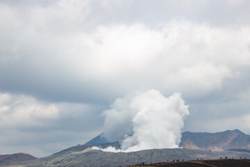Fototapeta premium Beautiful Spring landscape of Kusasenrigahama or Aso Kusasenri Grassland with Mount Aso Volcanic eruption. Aso, Kumamoto, Japan