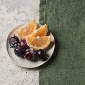 Sugared Orange Slices and Cherries on Ceramic Plate