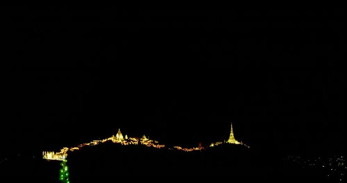Spectacular golden fireworks display exploding in the night sky during Phra Nakhon Khiri annual festival in Phetchaburi Thailand.