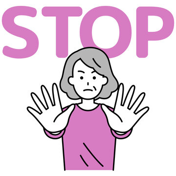 両手を前に出してSTOPと言う年配の女性