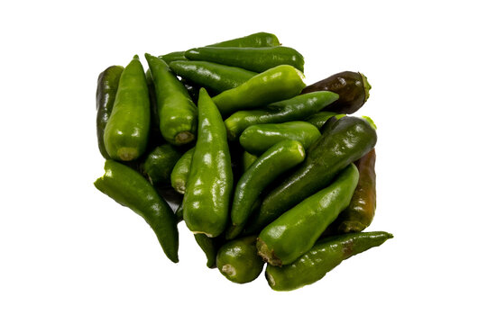 A pile of fresh, raw green chili peppers with smooth, glossy skins, arranged in a cluster against a light, neutral background
