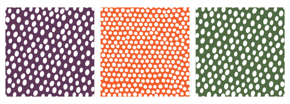 Set of three seamless polka dot vector patterns in purple, orange and green. Retro abstract backgrounds ideal for fabric, wrapping paper, stationery, packaging and surface design