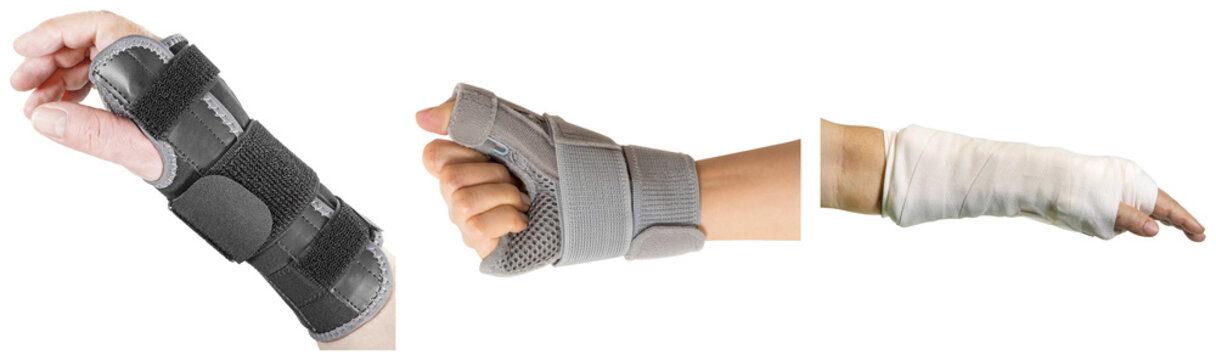 Three different types of wrist and thumb braces and a cast on a human arm, isolated on white background