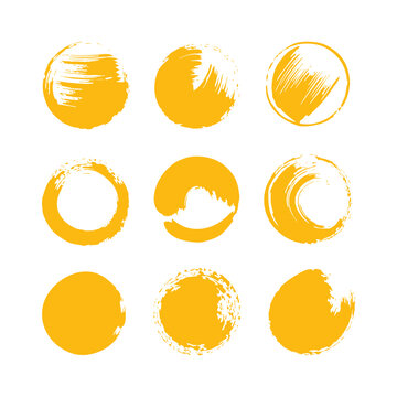 Hand painted yellow brush circle collection with textured acrylic paint strokes artistic round frame set abstract grunge design elements for creative use
