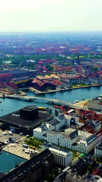 Vertical video. Copenhagen, Denmark. Amalienborg Palace, four identical Rococo mansions encircling an octagonal courtyard with the equestrian statue of Frederik V. Drone footage. Rich colors
