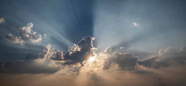 Panoramic Sunburst Sky with Dramatic Sun Rays Piercing Clouds.