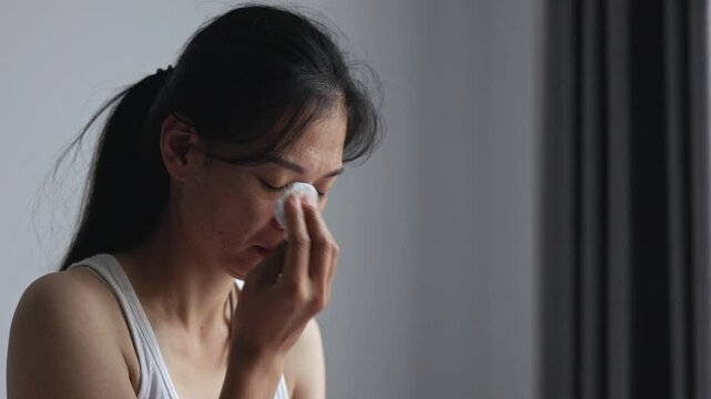 Emotional woman crying in distress, representing depression, domestic abuse, fear, trauma and the struggle to find safety, support and recovery.