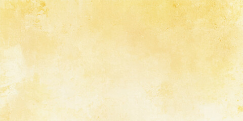 Obraz premium Abstract golden yellow watercolor background with bright aquarelle paint texture and subtle paper grain for creative design