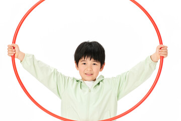 Boy Holding Red Hula Hoop Above His Head © CaoBaoTran