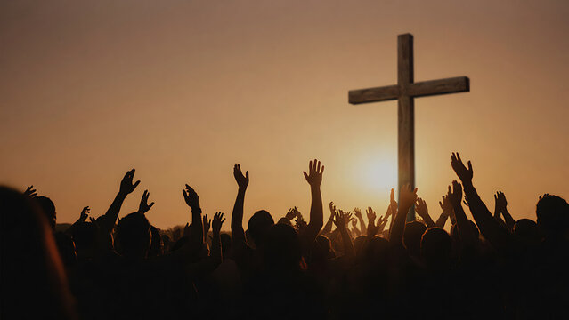 Outdoor worship congregation raising hands in devotion at sunset