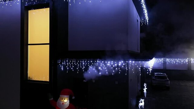 Santa and snowman stand beside each other. They glow brightly against a dark background. Festive lights hang above them, twinkling. Their cheerful expressions invite holiday joy