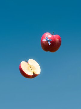 red apple on blue sky background