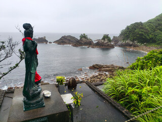Obraz premium Kannon Bosatsu Statue and Rocky Coastline View in Toyo on Shikoku Henro Pilgrimage Route, Kochi, Japan 2026