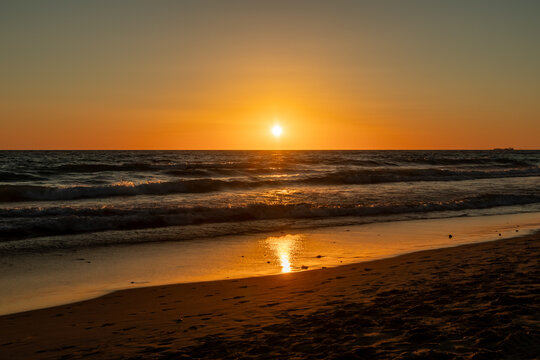 sunset on La Barrosa beach in Sancti Petri, Cadiz, Spain