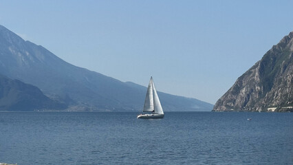Fototapeta premium Sailboat on Lake Garda near Riva del Garda Italy
