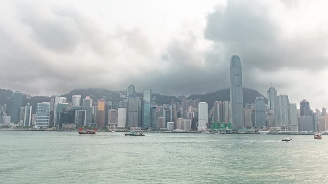 Timelapse of Victoria Harbour cityscape and harbor activity in Hong Kong