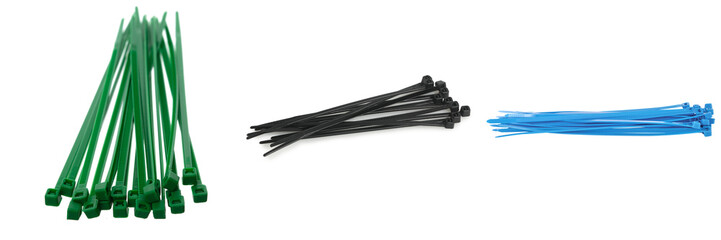 Three piles of zip ties: green, black, and blue, isolated on a white background. © Phuong