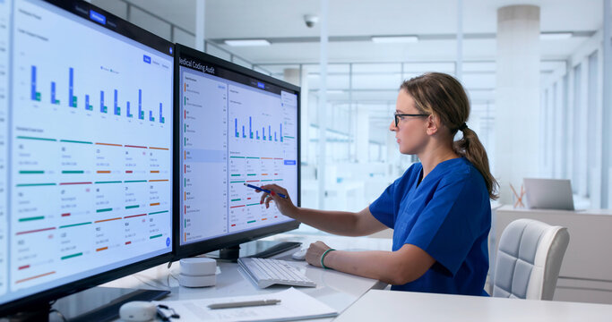 Woman Reviews Medical Records On Computer, Ensuring Accuracy