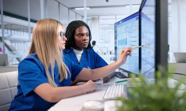 Young Woman Reviews Patient Insurance Claims While Working