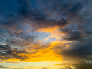 Fototapeta premium Dramatic Golden Hour Sky With Dark Clouds