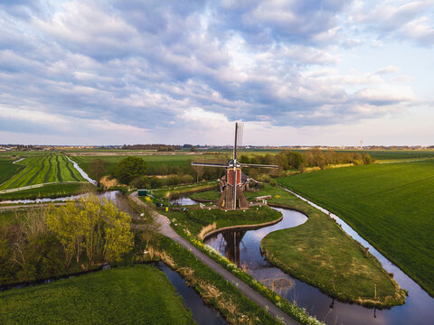 Iconic Dutch windmill surrounded by green fields