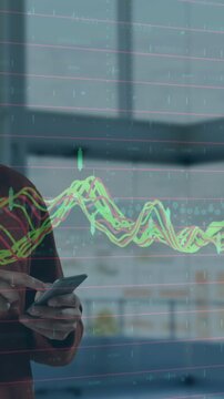 Animation of financial data processing over businessman using smartphone
