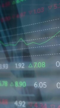 Animation of stock market data processing against low angle view of tall building