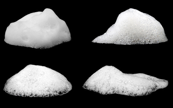 White soap foam bubbles isolated on a black background, showing soft frothy texture, clean shapes, and detailed lather for cleaning, hygiene, beauty, product packaging, and abstract design.