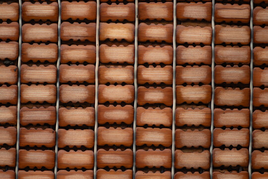 Full frame texture pattern of a traditional Vietnamese bamboo bead sleeping mat background