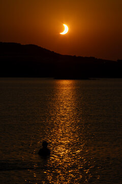 Solar Eclipse 2026 at Sunset Over Lake and Mountain Landscape - Alca&ntilde;iz - Spain