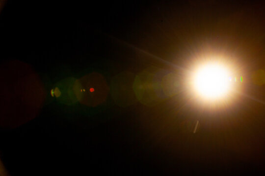 Sun flare on the black background
